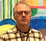 A person in glasses with a plaid shirt

AI-generated content may be incorrect.
