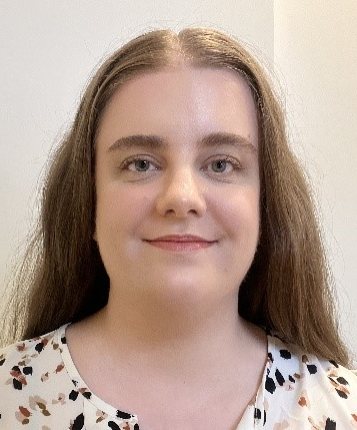 A person with long hair smiling
AI-generated content may be incorrect.