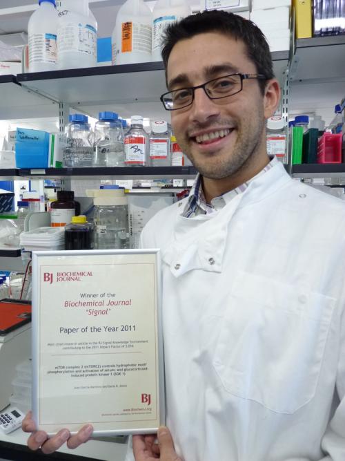 Juanma with his award Juan M. Garcia-Martinez presented with BJ Signal most-cited paper award