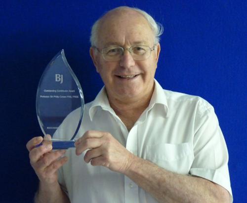 Philip holding the Outstanding Contributor Award Philip Cohen receives Outstanding Contributor Award from the Biochemical Journal